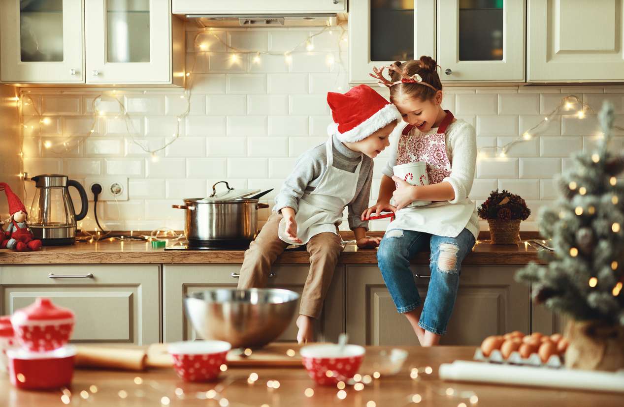 Kids baking in a festive kitchen — plan your kitchen remodel timeline to finish before the holidays