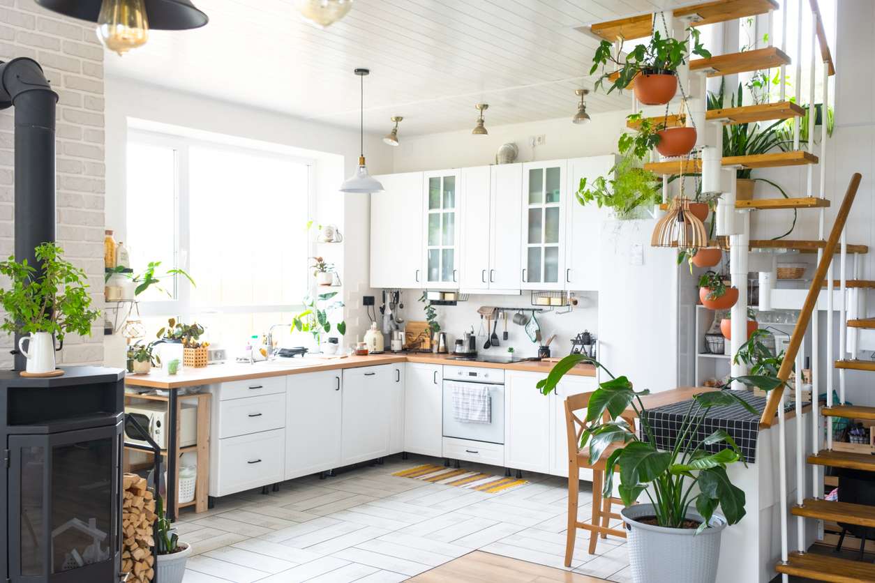 Custom kitchen design in Boise with white cabinets, open shelving, and abundant natural light